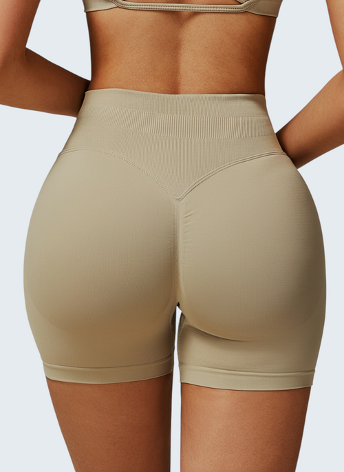 Shorts desportivos bege de cintura alta VD Beyond Limits com design seamless e efeito modelador para treino.
